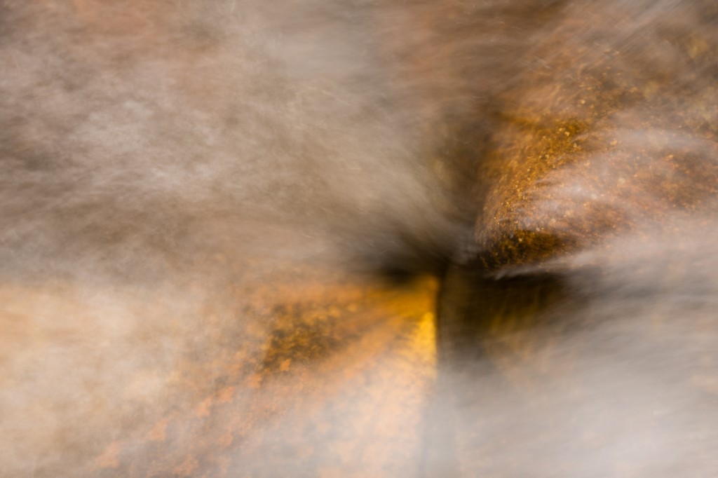 6 images of a stone in the river merged into one in camera.